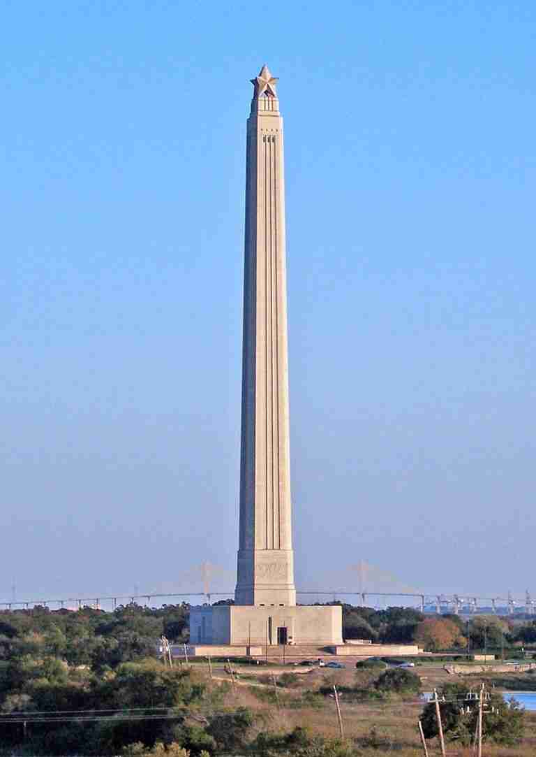 Photo of the San Jacinto Monument taken from the Battleship Texas in Fall 2006. The Fred Hartman Bridge is visible in the background.