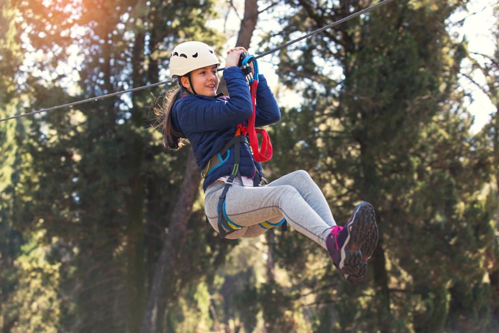 A girl enjoying her time in the zipline