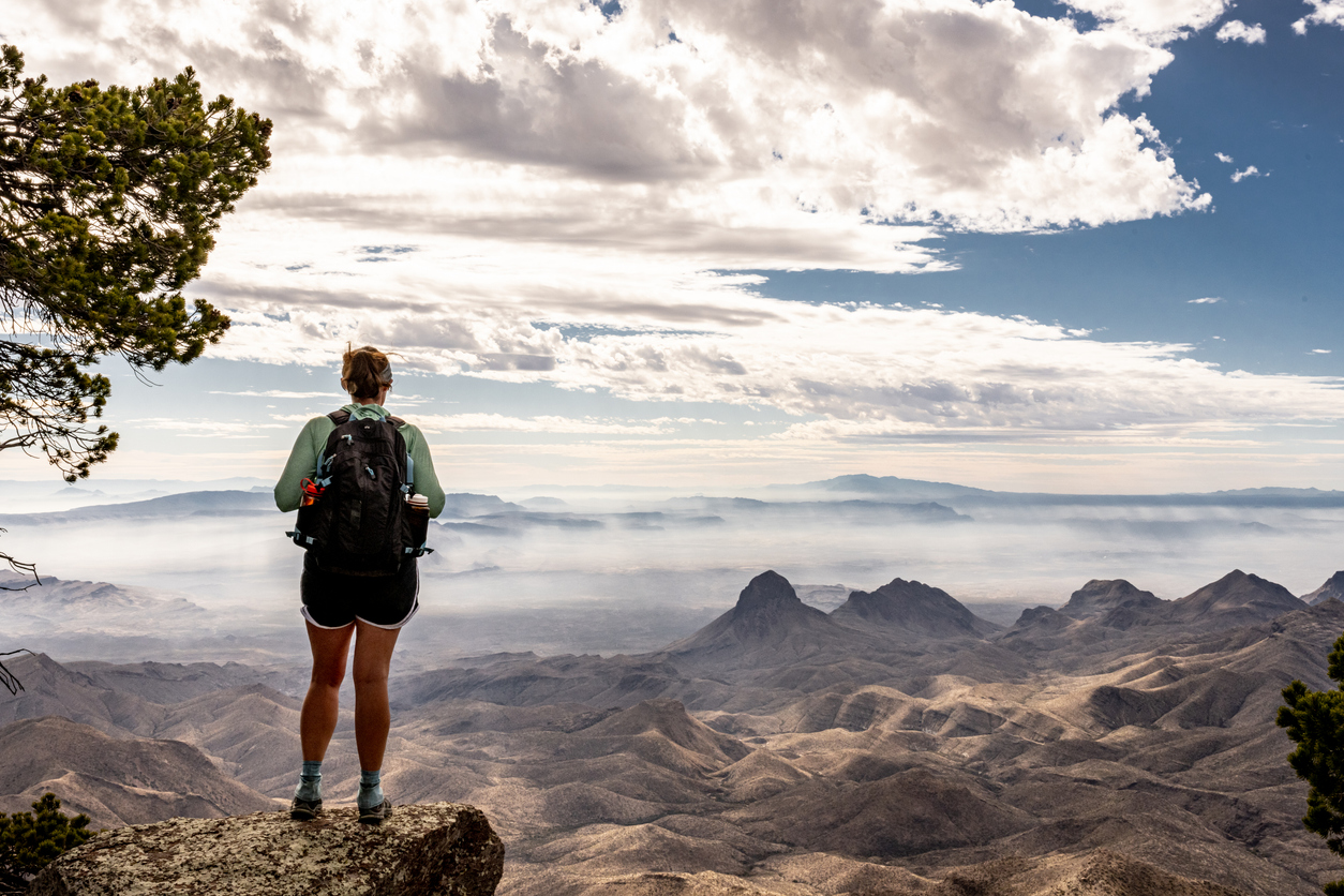 Hiker Looking Out From South Rim Trail