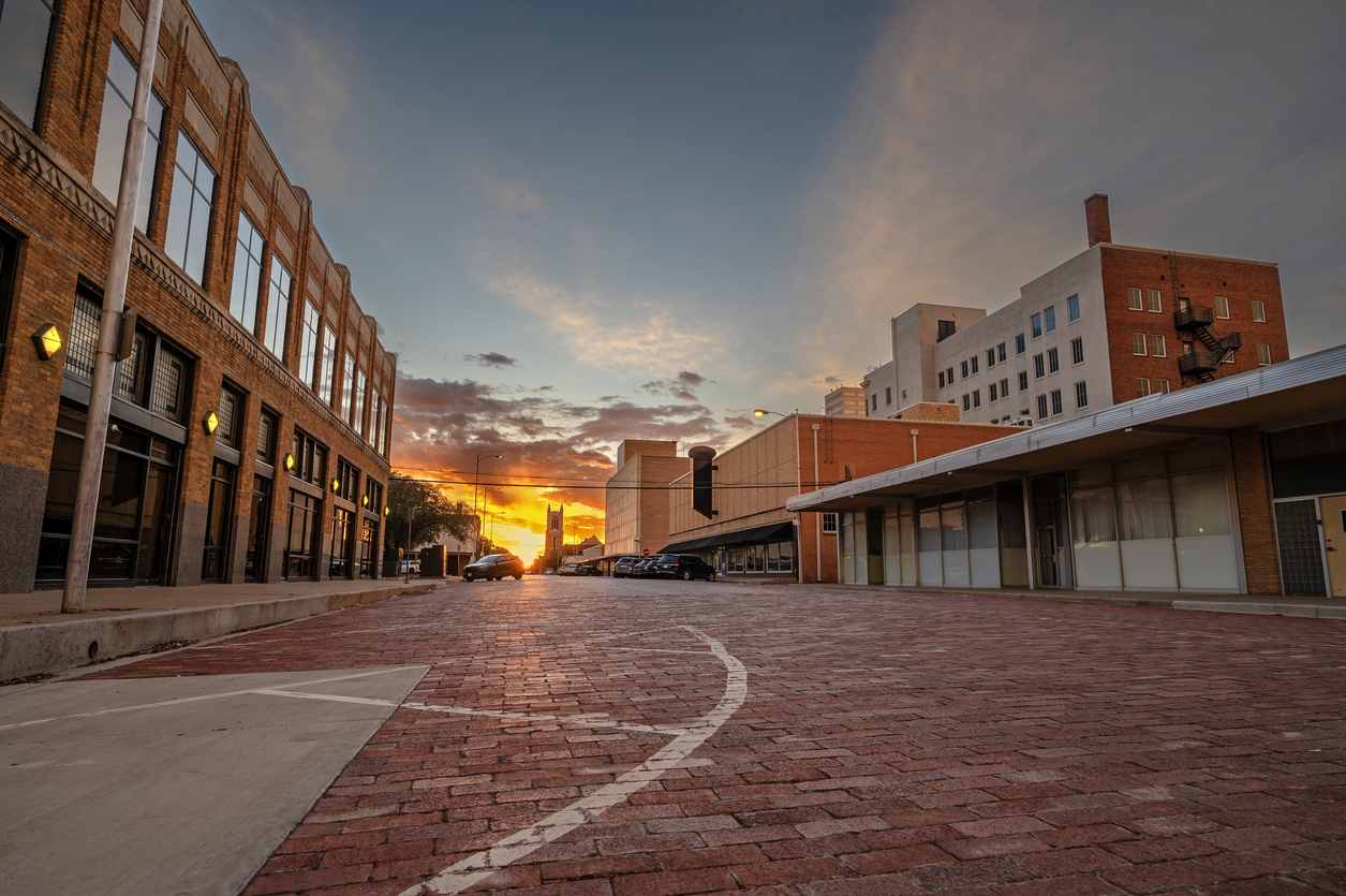 Sun setting on an old brick street in downtown, Lubbock, Texas