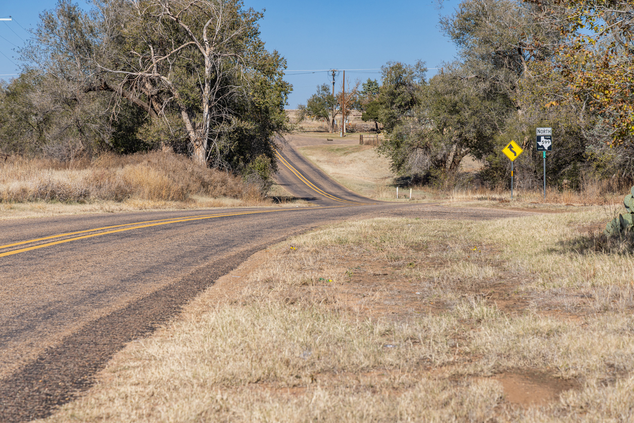 Winding rural farm road in Texas.